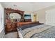This main bedroom has a large dresser with mirror and doorway to bath at 4015 Soaring Dr, Douglasville, GA 30135