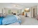 Large main bedroom with plush carpets, an entertainment center, and a ceiling fan at 4015 Soaring Dr, Douglasville, GA 30135