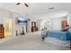 Expansive main bedroom featuring plush carpet, ensuite access, and a modern ceiling fan at 4015 Soaring Dr, Douglasville, GA 30135