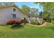 Expansive backyard featuring a wooden deck, lush green lawn, and mature landscaping at 3005 Howell Mill Rd, Atlanta, GA 30327