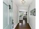 Inviting entryway showcasing hardwood floors, neutral paint, and light fixture, leading into living spaces at 3005 Howell Mill Rd, Atlanta, GA 30327