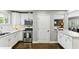 Modern kitchen with stainless steel appliances, white cabinets, and a marble countertop for a clean look at 3005 Howell Mill Rd, Atlanta, GA 30327