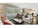 Open-concept living space combining living, dining, and kitchen areas with lots of natural light at 3005 Howell Mill Rd, Atlanta, GA 30327