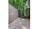 Gravel path through a horizontal wooden fence to an iron gate at 3075 Nuthatch Nw Ct, Kennesaw, GA 30144