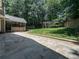 Beautiful backyard features a stone patio, pergola swing set, and a well-manicured lawn at 3075 Nuthatch Nw Ct, Kennesaw, GA 30144