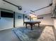 Basement game room with a pool table and painted blue accent walls at 3075 Nuthatch Nw Ct, Kennesaw, GA 30144
