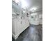 Bathroom featuring a double vanity, free-standing soaking tub and dark gray tiled floor at 3075 Nuthatch Nw Ct, Kennesaw, GA 30144