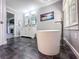 Bathroom featuring a soaking tub and gray tiled floor at 3075 Nuthatch Nw Ct, Kennesaw, GA 30144