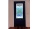 Contemporary black entry door with decorative glass panels at 3075 Nuthatch Nw Ct, Kennesaw, GA 30144