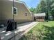 Spacious patio next to house overlooking the backyard with lush greenery and trees at 3075 Nuthatch Nw Ct, Kennesaw, GA 30144