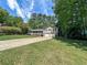 Landscaped home with a lush lawn, two-car garage, and inviting covered front porch at 3075 Nuthatch Nw Ct, Kennesaw, GA 30144