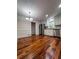 A kitchen with hardwood floors, stainless steel appliances, and white cabinets at 3075 Nuthatch Nw Ct, Kennesaw, GA 30144