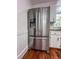 A stainless steel refrigerator with a water dispenser and white cabinets at 3075 Nuthatch Nw Ct, Kennesaw, GA 30144
