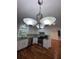Kitchen featuring stainless steel appliances, hardwood floors, and white cabinets at 3075 Nuthatch Nw Ct, Kennesaw, GA 30144