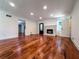 Spacious living room featuring hardwood floors, white walls, and fireplace at 3075 Nuthatch Nw Ct, Kennesaw, GA 30144