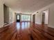 Open living room featuring gleaming hardwood floors, neutral walls and natural light at 3075 Nuthatch Nw Ct, Kennesaw, GA 30144