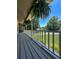 Relaxing covered porch with white railing, hanging plants, and pleasant neighborhood views at 3075 Nuthatch Nw Ct, Kennesaw, GA 30144