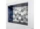 Shower niche tiled with decorative mosaic tiles provides a convenient storage space at 3075 Nuthatch Nw Ct, Kennesaw, GA 30144