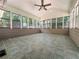 Bright sunroom with ample windows offering natural light and a view of the surrounding greenery at 3075 Nuthatch Nw Ct, Kennesaw, GA 30144