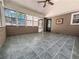 Spacious sunroom featuring tiled flooring, a ceiling fan, and access to the outside at 3075 Nuthatch Nw Ct, Kennesaw, GA 30144