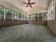 Bright sunroom with tile flooring, vaulted ceilings and multiple windows overlooking the backyard at 3075 Nuthatch Nw Ct, Kennesaw, GA 30144