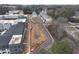 Aerial view of a modern complex including townhomes and apartments, with ample parking and greenery at 1907 Deco Dr, Kennesaw, GA 30144
