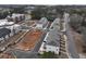 Modern townhomes with a common lawn area, surrounded by ample parking and nearby apartment buildings at 1907 Deco Dr, Kennesaw, GA 30144