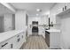 Modern kitchen boasts stainless appliances, white cabinets, and ample counter space at 2246 Hightrail Ct, Lithonia, GA 30058