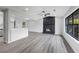 Open-concept living space features gray flooring, a fireplace, and abundant natural light at 2246 Hightrail Ct, Lithonia, GA 30058