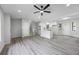 Open floor plan with gray flooring, stairs, and eat-in kitchen at 2246 Hightrail Ct, Lithonia, GA 30058