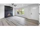 The living room features gray flooring, a fireplace, and abundant natural light at 2246 Hightrail Ct, Lithonia, GA 30058