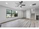 Spacious living area with gray flooring, large windows, and stairs at 2246 Hightrail Ct, Lithonia, GA 30058