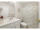 Clean bathroom with a single sink vanity, tub with shower, and tiled flooring at 2487 Battery Pointe, Lawrenceville, GA 30043