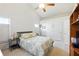 Comfortable bedroom featuring neutral tones, soft carpet, and a ceiling fan for optimal air circulation at 2487 Battery Pointe, Lawrenceville, GA 30043
