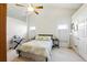 Bright bedroom with neutral colors and large windows provides a serene retreat at 2487 Battery Pointe, Lawrenceville, GA 30043
