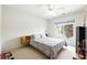 Cozy bedroom featuring a large window and a ceiling fan at 2487 Battery Pointe, Lawrenceville, GA 30043