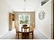 Bright dining room with views of the outdoors offers a comfortable space for Gathering meals at 2487 Battery Pointe, Lawrenceville, GA 30043