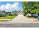 Charming home with a manicured lawn, long driveway and two car garage at 2487 Battery Pointe, Lawrenceville, GA 30043