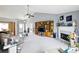Bright living room featuring built-in shelving, a fireplace, and views into the dining room at 2487 Battery Pointe, Lawrenceville, GA 30043