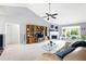 Spacious living room featuring built-in shelving, a fireplace, and natural light at 2487 Battery Pointe, Lawrenceville, GA 30043