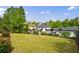 Spacious backyard with lush lawn, privacy fence, and manicured landscaping creates a serene outdoor oasis at 510 Belada Blvd, Atlanta, GA 30342