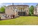 The brick exterior features a second story screened porch, walk out basement, and in-ground pool at 510 Belada Blvd, Atlanta, GA 30342