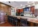 Custom bar featuring wood cabinets, tile countertop, and decor for a fun atmosphere at 510 Belada Blvd, Atlanta, GA 30342
