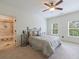 Bright bedroom with a full bed, carpet, windows, and an ensuite bathroom at 510 Belada Blvd, Atlanta, GA 30342