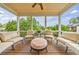 Inviting covered patio with comfortable lounge seating and views of the lush, green surroundings at 510 Belada Blvd, Atlanta, GA 30342