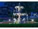 Ornate fountain with detailed sculptures and water features, set against a residential backdrop at 510 Belada Blvd, Atlanta, GA 30342