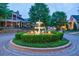 Circular driveway and manicured fountain surrounded by lush greenery at 510 Belada Blvd, Atlanta, GA 30342