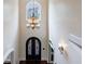 Grand foyer featuring a soaring ceiling, arched doorway and an elegant chandelier above the front door at 510 Belada Blvd, Atlanta, GA 30342