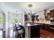 Gourmet kitchen features a large center island with seating, dark wood cabinets, and a breakfast nook at 510 Belada Blvd, Atlanta, GA 30342