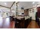 Large kitchen with dark wood cabinets, granite countertops, and stainless steel appliances at 510 Belada Blvd, Atlanta, GA 30342